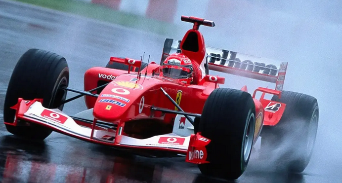 Ferrari Formula 1 car racing in wet conditions